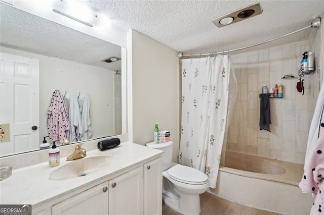 3530 Piedmont Rd NE Unit 2I, Atlanta, GA 30305 - full bathroom with a textured ceiling, vanity, shower / tub combo, and wood finished floors