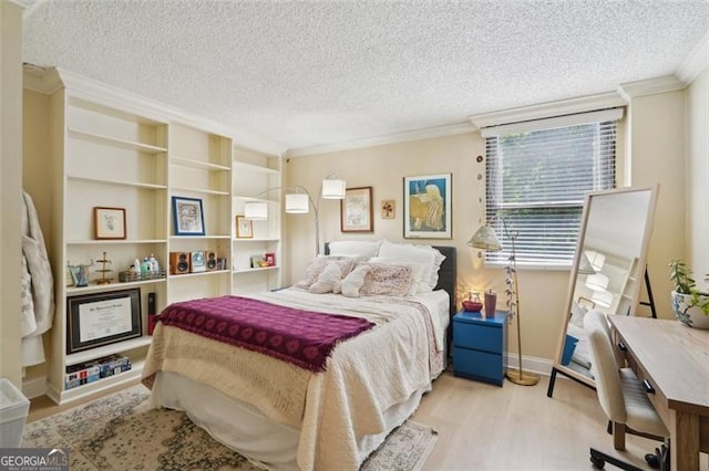 3530 Piedmont Rd NE Unit 2I, Atlanta, GA 30305 - bedroom featuring a textured ceiling, ornamental molding, and wood finished floors