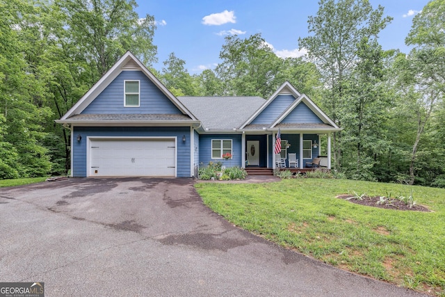 405 Dugas Rd, Dahlonega, GA 30533 - view of front of home with a porch, driveway, a front yard, roof with shingles, and a garage