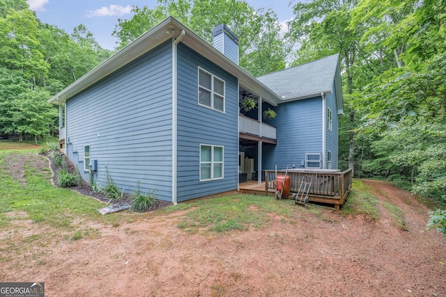 405 Dugas Rd, Dahlonega, GA 30533 - back of property featuring a chimney, a balcony, and a deck