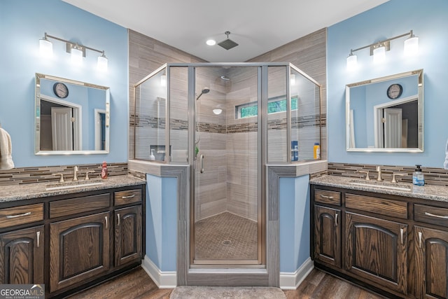 405 Dugas Rd, Dahlonega, GA 30533 - bathroom with a shower stall, two vanities, wood finished floors, and baseboards