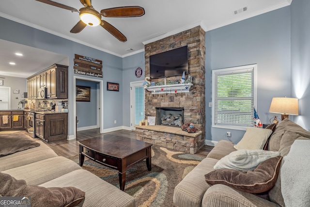 405 Dugas Rd, Dahlonega, GA 30533 - living area featuring ornamental molding, a ceiling fan, a fireplace, wood finished floors, and baseboards