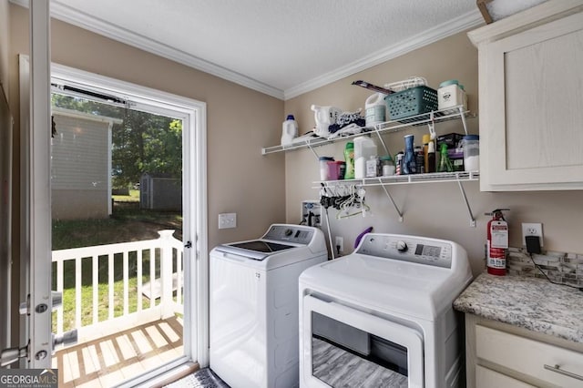 131 Bob White Ln, Newnan, GA 30263 - washroom featuring washing machine and dryer, ornamental molding, and a textured ceiling