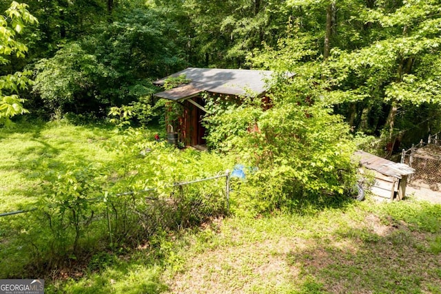 1395 Clay Rd SW, Mableton, GA 30126 - view of yard with an outdoor structure and a wooded view