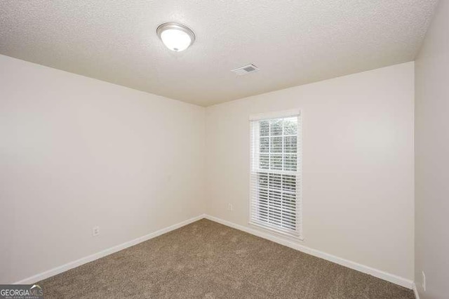 4112 Meadowlark Ct, Powder Springs, GA 30127 - carpeted empty room with a textured ceiling and baseboards