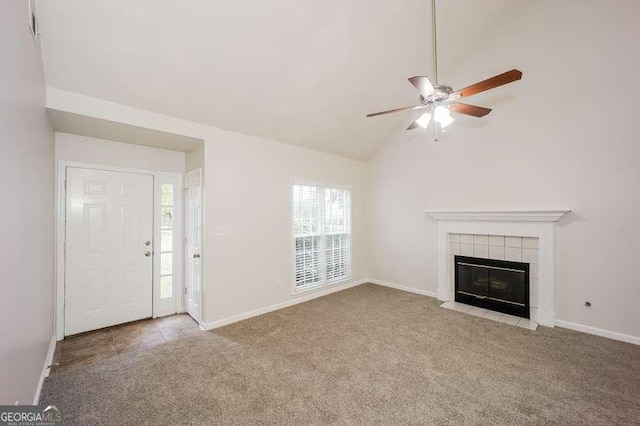 4112 Meadowlark Ct, Powder Springs, GA 30127 - unfurnished living room featuring carpet floors, a ceiling fan, a tile fireplace, baseboards, and vaulted ceiling