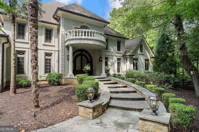 760 River Gate Dr, Atlanta, GA 30350 - view of front of property featuring a balcony, a shingled roof, and stucco siding