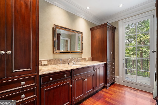 760 River Gate Dr, Atlanta, GA 30350 - bathroom with vanity, wood finished floors, and crown molding