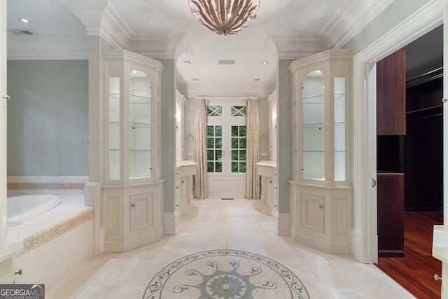 760 River Gate Dr, Atlanta, GA 30350 - full bathroom with vanity, a bath, ornamental molding, inlaid floor details, and a chandelier
