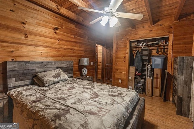 218 Green Acre Ln, Cartersville, GA 30121 - bedroom with wooden walls, wood ceiling with exposed beams, wood finished floors, a closet, and ceiling fan