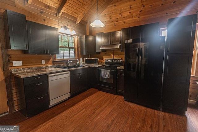 218 Green Acre Ln, Cartersville, GA 30121 - kitchen featuring black appliances, under cabinet range hood, dark wood finished floors, a sink, and wood walls