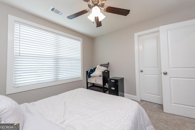 924 Abingdon Cv, Bonaire, GA 31005 - bedroom with light colored carpet, ceiling fan, and baseboards
