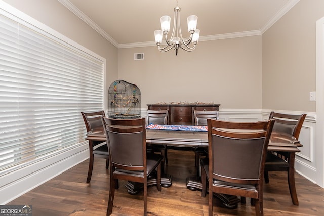 924 Abingdon Cv, Bonaire, GA 31005 - dining area with crown molding, a chandelier, wood finished floors, and wainscoting