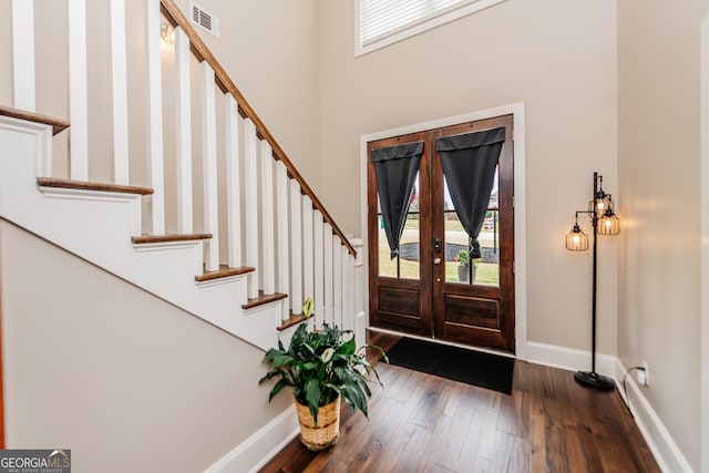 924 Abingdon Cv, Bonaire, GA 31005 - foyer featuring stairs, dark wood finished floors, baseboards, and a high ceiling