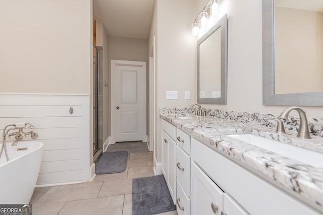 924 Abingdon Cv, Bonaire, GA 31005 - full bath with double vanity, a freestanding bath, a stall shower, and tile patterned floors