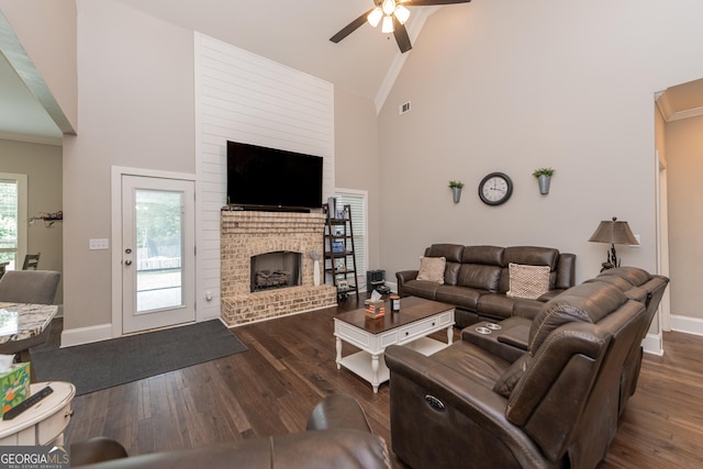 924 Abingdon Cv, Bonaire, GA 31005 - living room with a ceiling fan, wood finished floors, high vaulted ceiling, baseboards, and a brick fireplace