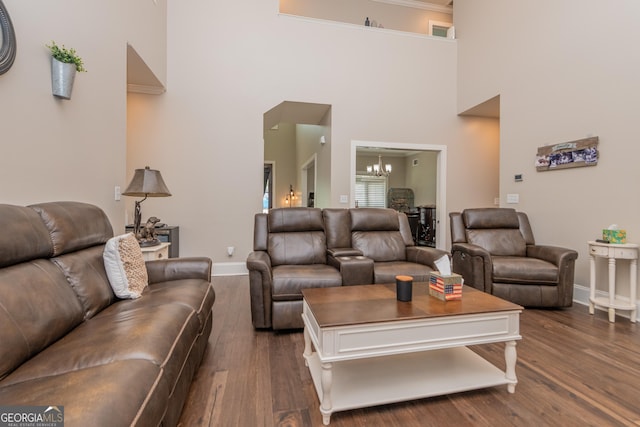924 Abingdon Cv, Bonaire, GA 31005 - living area with a chandelier, a high ceiling, dark wood finished floors, and baseboards
