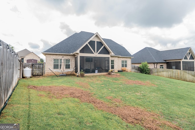 924 Abingdon Cv, Bonaire, GA 31005 - rear view of house featuring brick siding, a sunroom, roof with shingles, and a gate