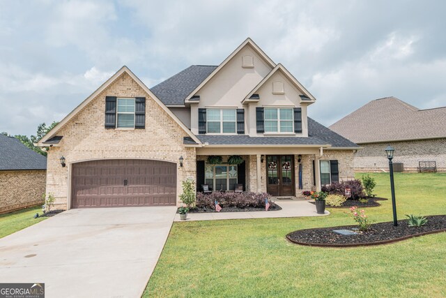 924 Abingdon Cv, Bonaire, GA 31005 - view of front of house with roof with shingles, an attached garage, french doors, concrete driveway, and a front yard