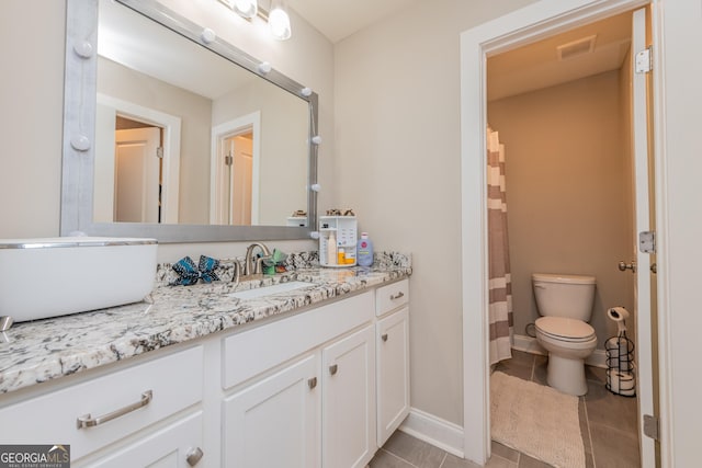 924 Abingdon Cv, Bonaire, GA 31005 - full bath with toilet, vanity, tile patterned flooring, baseboards, and a shower with shower curtain