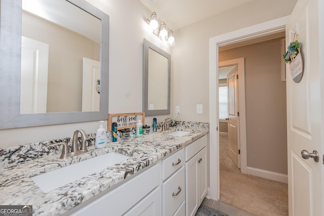 924 Abingdon Cv, Bonaire, GA 31005 - bathroom with double vanity and baseboards