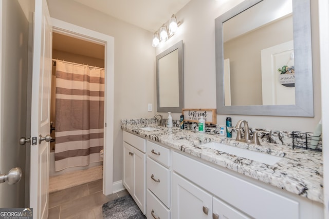 924 Abingdon Cv, Bonaire, GA 31005 - full bathroom featuring double vanity, toilet, a shower with curtain, and tile patterned floors