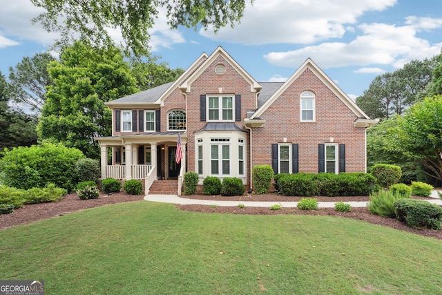 151 Overhill Pt, Alpharetta, GA 30005 - view of front of property with brick siding, covered porch, and a front lawn