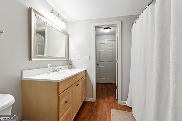 151 Overhill Pt, Alpharetta, GA 30005 - full bath featuring wood finished floors, vanity, toilet, and a shower with curtain