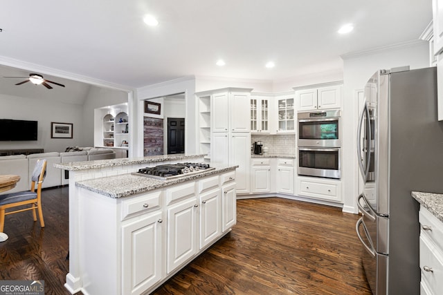 151 Overhill Pt, Alpharetta, GA 30005 - kitchen with appliances with stainless steel finishes, open floor plan, crown molding, ceiling fan, and dark wood finished floors