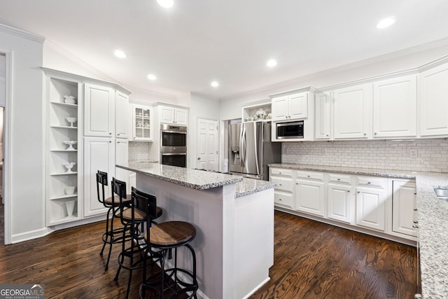 151 Overhill Pt, Alpharetta, GA 30005 - kitchen with stainless steel appliances, crown molding, a kitchen island, a kitchen bar, and white cabinets