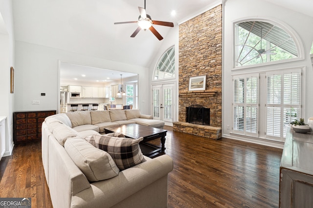 151 Overhill Pt, Alpharetta, GA 30005 - living area featuring high vaulted ceiling, plenty of natural light, a ceiling fan, dark wood-type flooring, and a stone fireplace