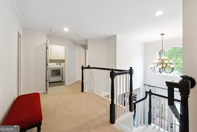 151 Overhill Pt, Alpharetta, GA 30005 - hall with washing machine and clothes dryer, an upstairs landing, attic access, light carpet, and crown molding