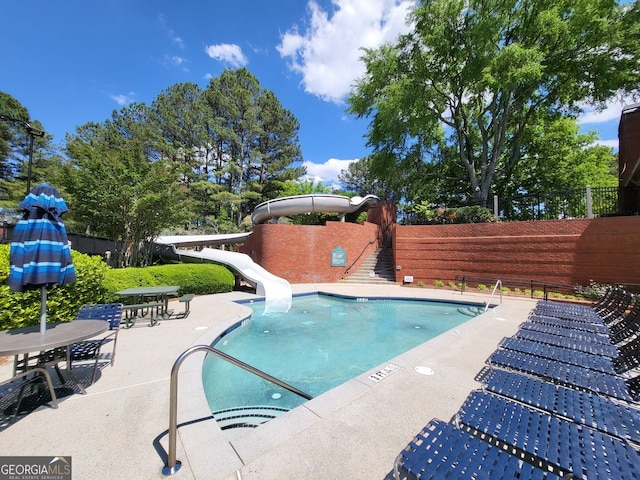 151 Overhill Pt, Alpharetta, GA 30005 - community pool with a water slide and a patio area