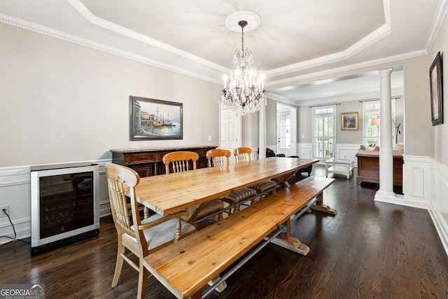 151 Overhill Pt, Alpharetta, GA 30005 - dining room featuring wine cooler, crown molding, dark wood-style floors, a raised ceiling, and a wainscoted wall