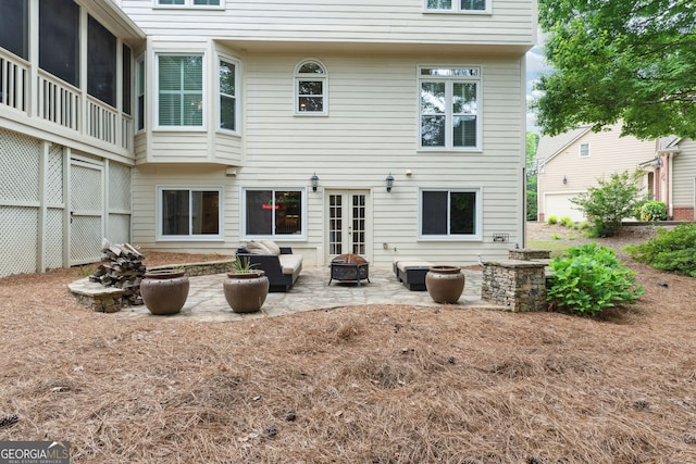 151 Overhill Pt, Alpharetta, GA 30005 - rear view of property with a patio area, an outdoor fire pit, and french doors