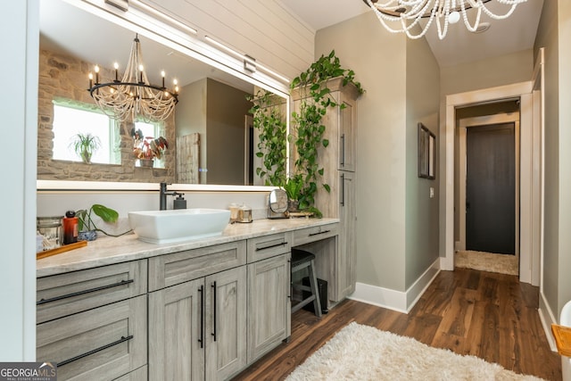 209 Voyles Way, Dawsonville, GA 30534 - bar area with a chandelier, a sink, dark wood-style floors, and hanging light fixtures