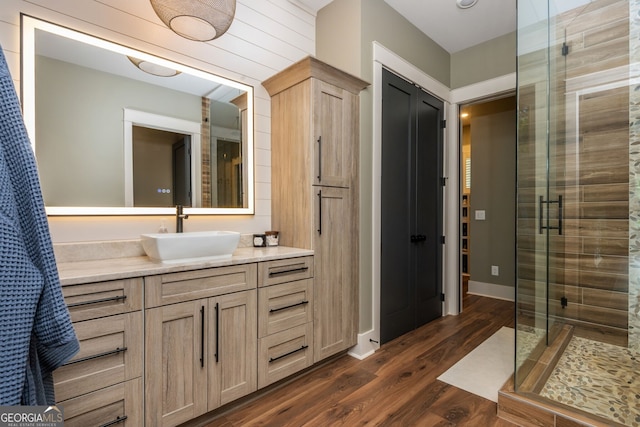 209 Voyles Way, Dawsonville, GA 30534 - bathroom with vanity, a shower stall, and wood finished floors