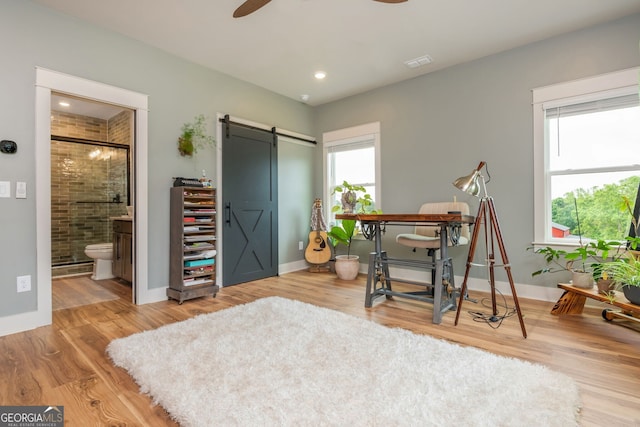 209 Voyles Way, Dawsonville, GA 30534 - office space featuring a barn door, wood finished floors, baseboards, and a ceiling fan