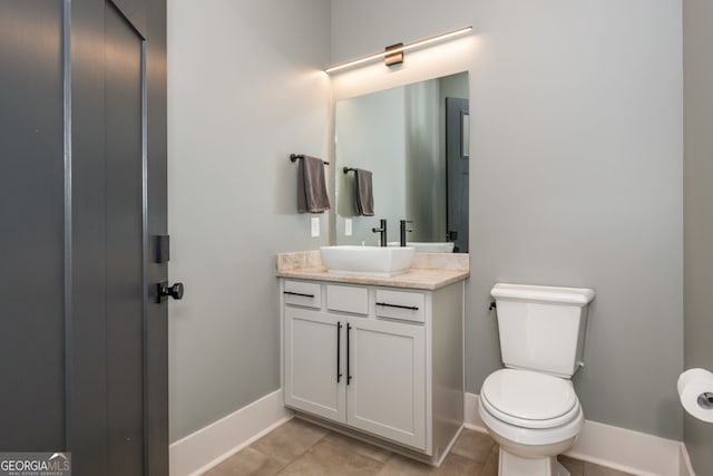 209 Voyles Way, Dawsonville, GA 30534 - bathroom with vanity, toilet, baseboards, and tile patterned flooring
