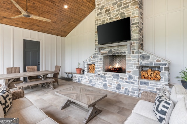 209 Voyles Way, Dawsonville, GA 30534 - living room featuring vaulted ceiling, wooden ceiling, a decorative wall, and a fireplace