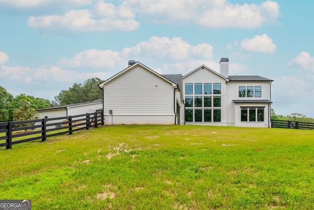 209 Voyles Way, Dawsonville, GA 30534 - back of house featuring a chimney