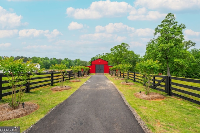 209 Voyles Way, Dawsonville, GA 30534 - view of asphalt driveway with a barn and a rural view