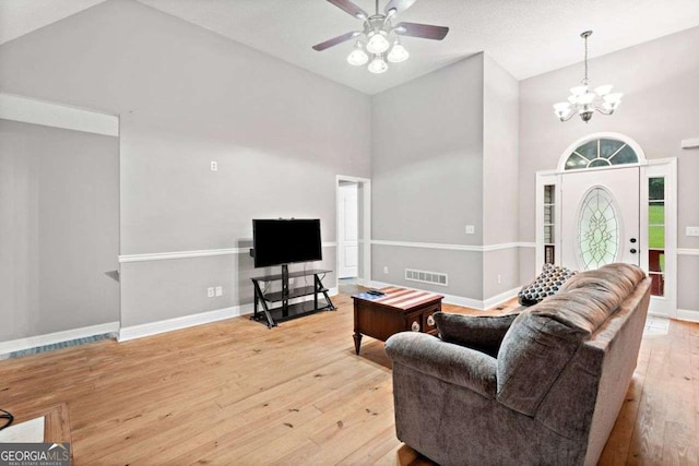 4544 Dorsett Shoals Run, Douglasville, GA 30135 - living area featuring high vaulted ceiling, hardwood / wood-style floors, a chandelier, and a ceiling fan