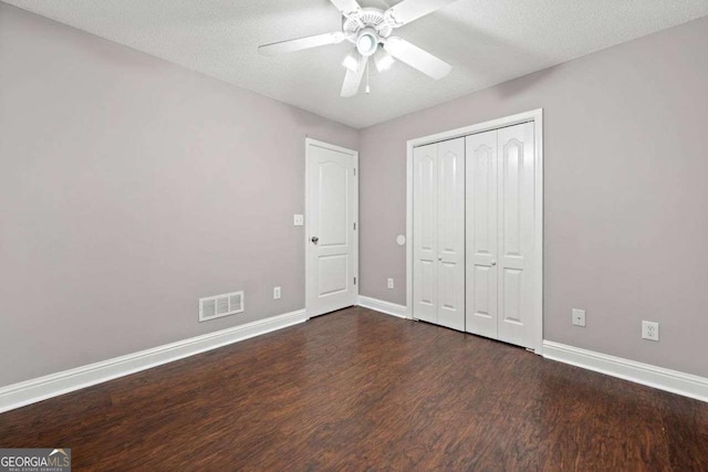 4544 Dorsett Shoals Run, Douglasville, GA 30135 - unfurnished bedroom with wood finished floors, a closet, and ceiling fan