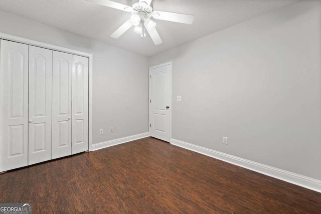 4544 Dorsett Shoals Run, Douglasville, GA 30135 - unfurnished bedroom with wood finished floors, a closet, and a ceiling fan