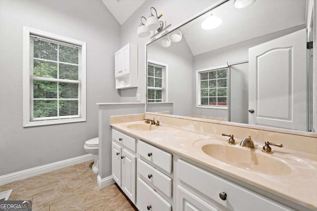 4544 Dorsett Shoals Run, Douglasville, GA 30135 - full bathroom with lofted ceiling and double vanity