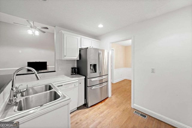 4544 Dorsett Shoals Run, Douglasville, GA 30135 - kitchen featuring stainless steel fridge with ice dispenser, dishwasher, white cabinetry, light wood-style floors, and a ceiling fan