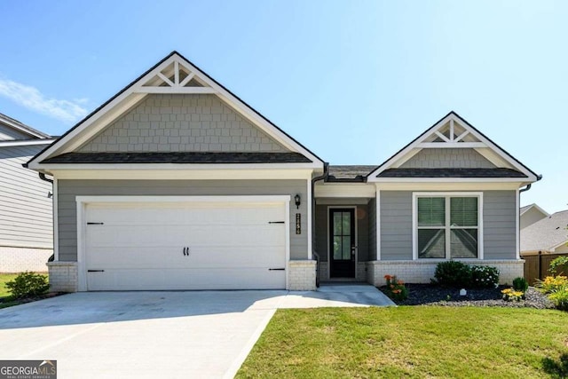 2856 Knob Creek Dr, Snellville, GA 30078 - craftsman-style home with brick siding, concrete driveway, a front yard, and an attached garage