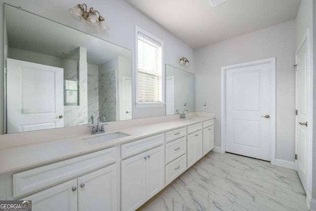 2856 Knob Creek Dr, Snellville, GA 30078 - bathroom with marble look tile flooring, double vanity, a marble finish shower, and baseboards