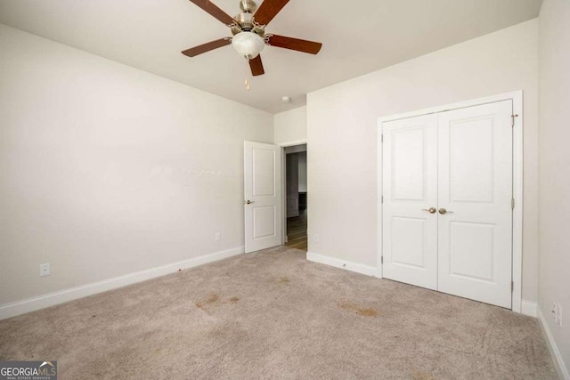 2856 Knob Creek Dr, Snellville, GA 30078 - unfurnished bedroom with carpet, baseboards, a closet, and a ceiling fan